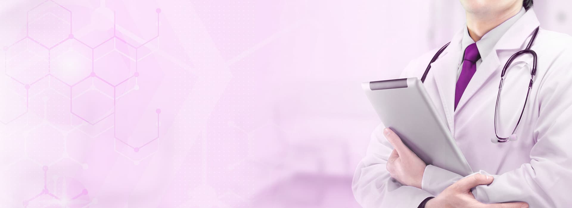 Doctor in a white coat with stethoscope holding a tablet